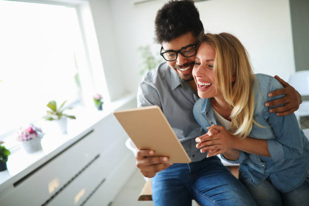 istock Happy couple in love surfing on tablet 1148796971