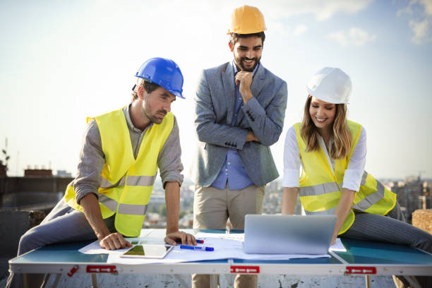 istock Architects, business manager and engineer meeting project at building site 1148798244