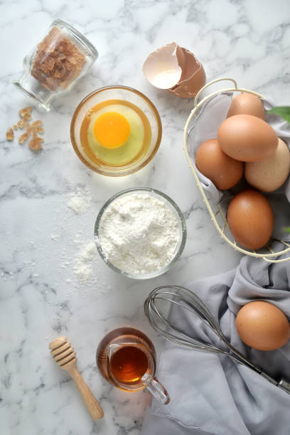 istock Ingredients for pancakes, cake, baking on a marble background. Top View 1148799277