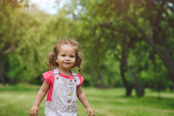 istock Cute toddler girl outdoors enjoying spring or summer day 1148801100