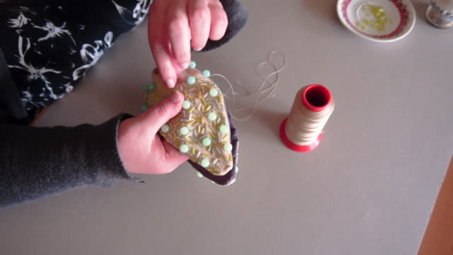 Woman making handmade jewellery