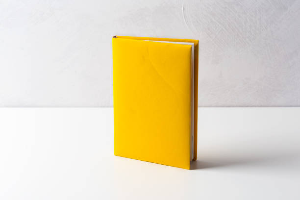 istock pile of paperback books on a table 1148802751