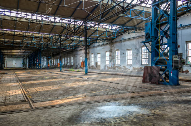 istock Sunbeams shine in an old factory 1148802856