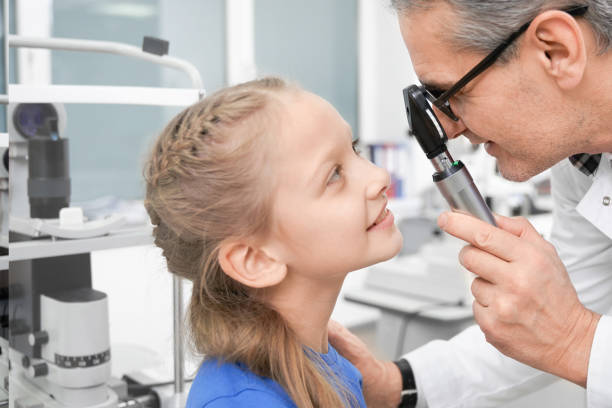 istock Side view of pretty girl testing vision in optical store 1148803913