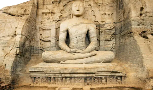 Stunning view of the beautiful Samadhi statue carved in stone. The Samadhi Statue is a statue situated at Mahamevnawa Park in Anuradhapura, Sri Lanka.