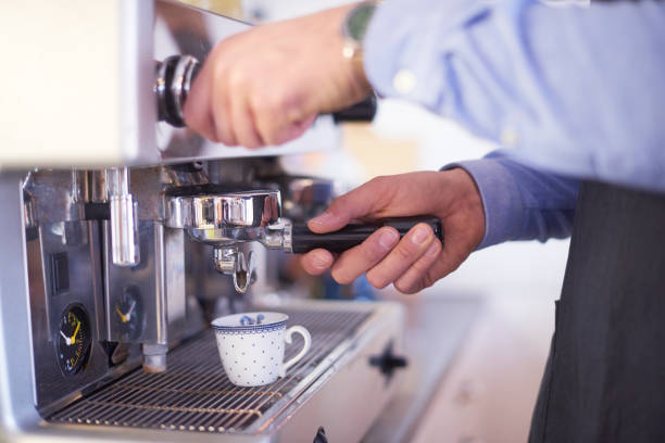 istock Close-up of water's hand while brewing coffee 1148805163
