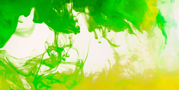 Colored green and yellow stains on white background