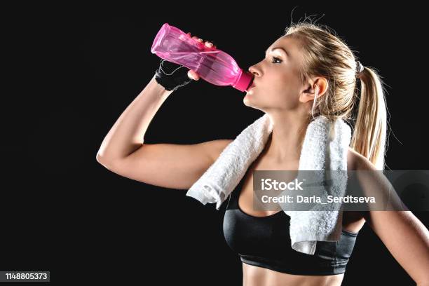 Athlete Drinks Water After Exercise Stock Photo - Download Image Now - Adult, Athlete, Beautiful People