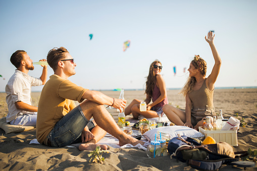 Friends go partying on the beach