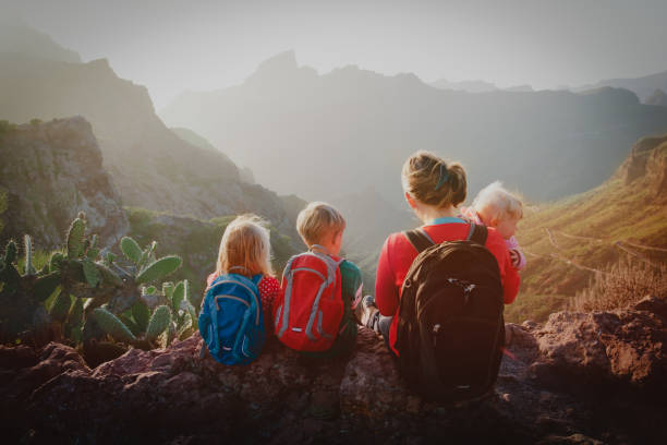 istock mother with three kids hiking in mountains 1148807588