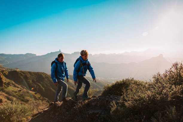 istock father and son hiking in scenic mountains 1148808006