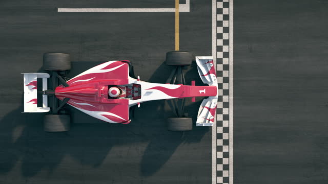Top view of a open-wheel single-seater racing car race car driving over finish line in slow motion
