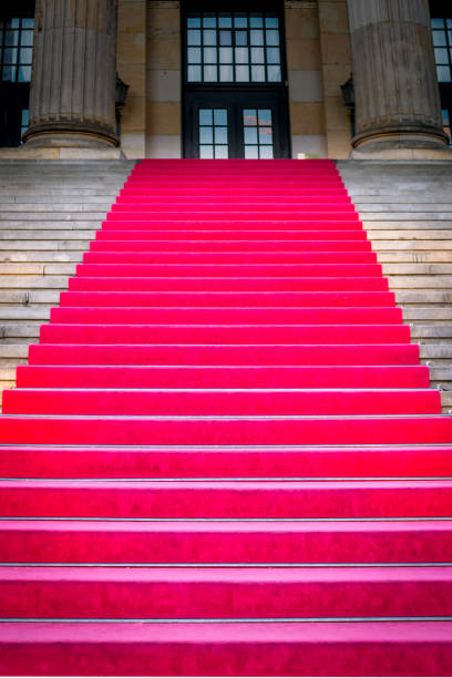 Red carpet on marble stairway welcoming VIPs.Red carpet on marble stairway welcoming VIPs.