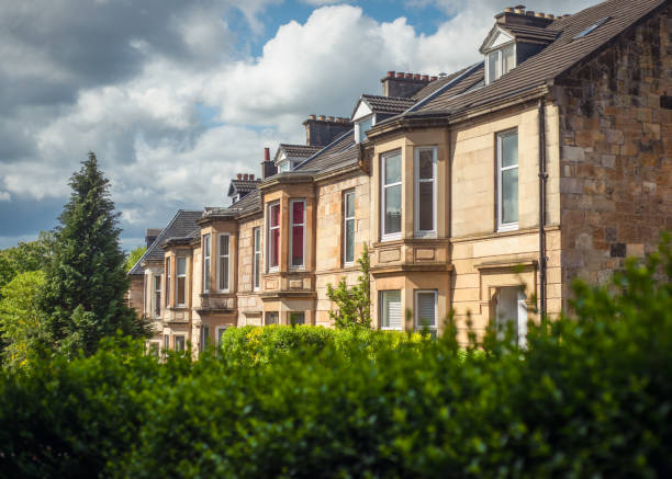 Sandstone Terrace Houses on a Leafy Street in the Southside of Glasgow Blonde Sandstone Terraced Homes on a Tree Lined Street in Glasgow Scotland glasgow scotland stock pictures, royalty-free photos & images