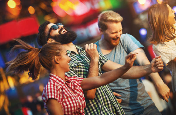 istock Friends dancing at a concert. 1148814900