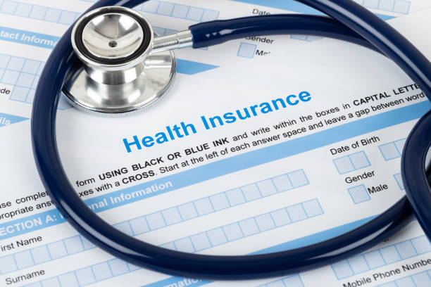 istock Health insurance application form with stethoscope and calculator 1148815901