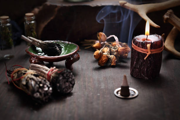 Altar at the fairies. Herbal incense and mysterious accessories on the table.  Horizontal composition