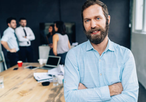 istock Businessman with his team behind 1148820922