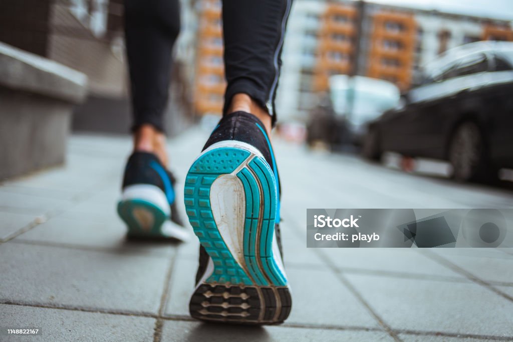 Close up shot of runner's shoes Walking Stock Photo