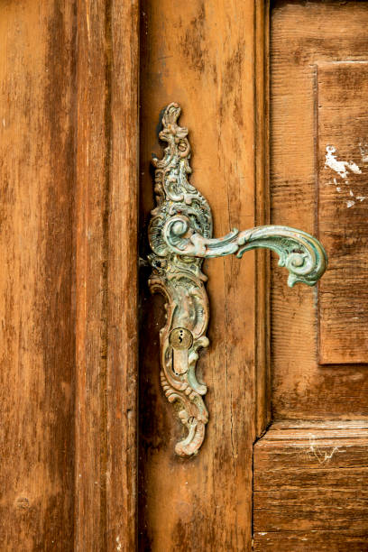 istock Old metal handle on wooden door 1148822671
