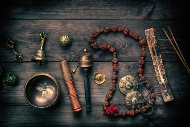istock Copper singing bowl, prayer beads, prayer drum and other Tibetan religious objects for meditation 1148823217
