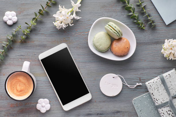 istock Springtime flat lay with pearl hyacinth flowers, eucalyptus, mobile phone and cards 1148824093