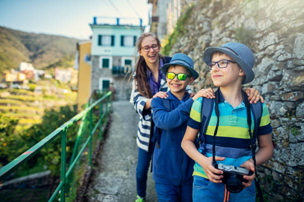 istock Three little tourists sightseeing Corniglia in Cinque Terre, Italy 1148825247