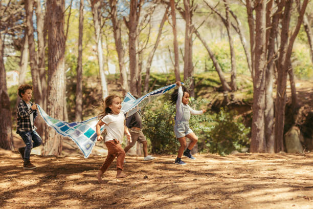 istock Kids enjoying together in park 1148825520