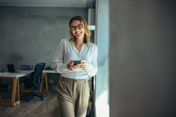 istock Cheerful businesswoman in office 1148826738