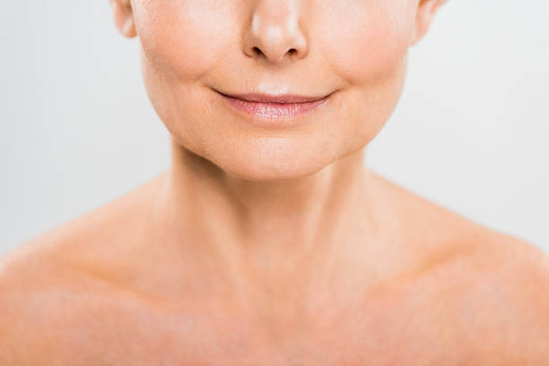 istock selective focus of mature woman isolated on grey with copy space 1148826791