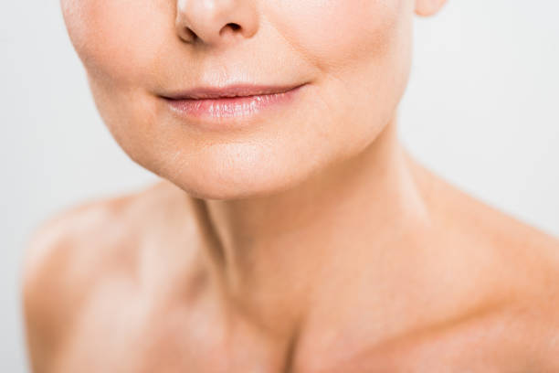 istock selective focus of mature woman isolated on grey with copy space 1148826796