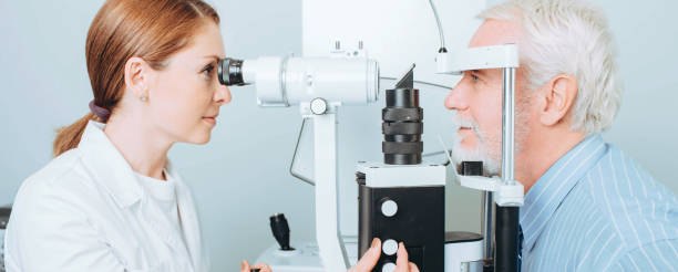 istock Senior man getting eye exam at clinic, close-up 1148827548