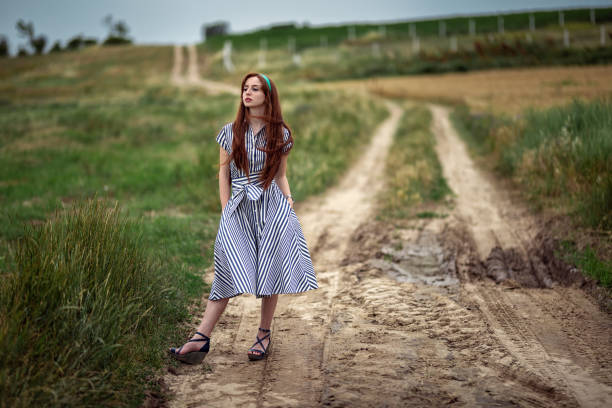 istock A woman walking on path in nature. 1148827887