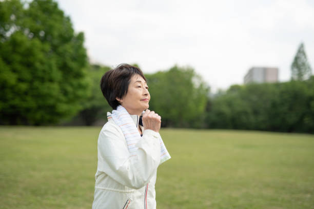 istock Senior woman walking in park 1148828658