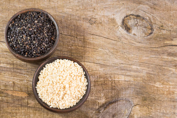 istock White sesame and black sesame seed - Sesamum indicum. 1148830243