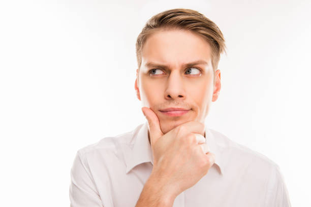 istock Smiling handsome pondered young man thinking about smth 1148832548