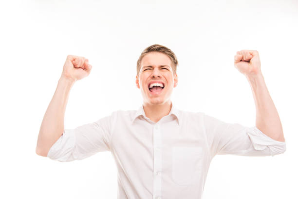 istock Attractive young man achievement a goal and screaming 1148832568