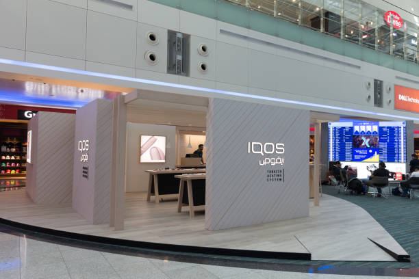 IQOS electronic cigarette Store at Dubai International Airport Dubai, United Arab Emirates - March 31, 2019: IQOS electronic cigarette Store at Dubai International Airport. It is a heated tobacco product. iqos e cig stock pictures, royalty-free photos & images
