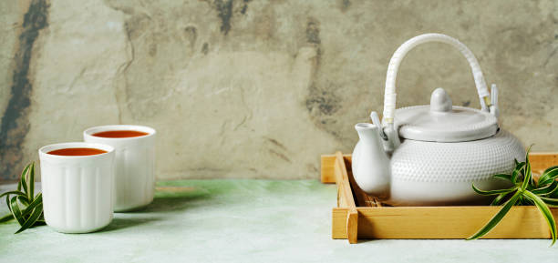 istock Chinese teapot and two cups. Free space for your text. 1148834988