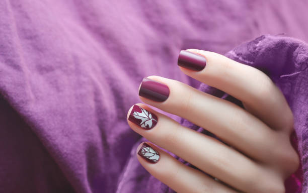 Female hand with dark purple nail design. Female hand with dark purple nail design fall nail art stock pictures, royalty-free photos & images