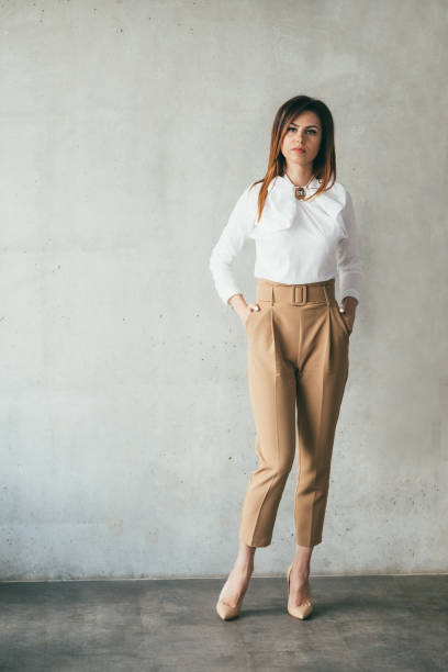 istock young lady hands pockets confident business boss 1148838812