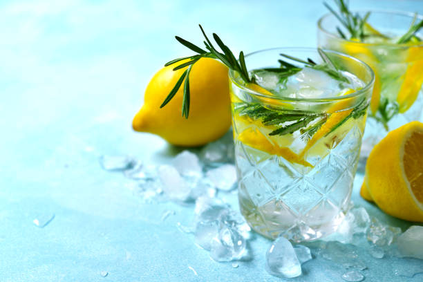 istock Summer citrus cocktail or lemonade with rosemary 1148839046