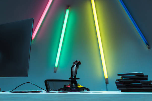 istock computer monitor, joystick and compact disks with video games on table 1148844091