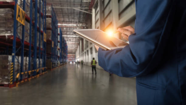 istock Businessman manager using tablet check and control for workers with Modern Trade warehouse logistics. Industry 4.0 concept 1148850800