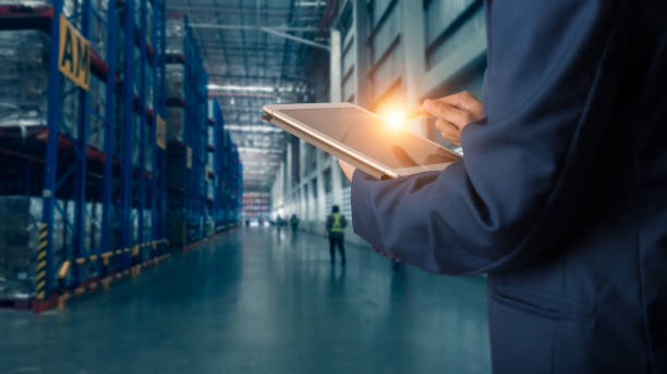istock Businessman manager using tablet check and control for workers with Modern Trade warehouse logistics. Industry 4.0 concept 1148850824