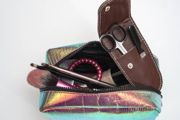 istock Manicure scissors in a leather brown case. Cosmetic bag, wallet pedicure accessories. Fashionable beauty theme. Stock photo 1148852212