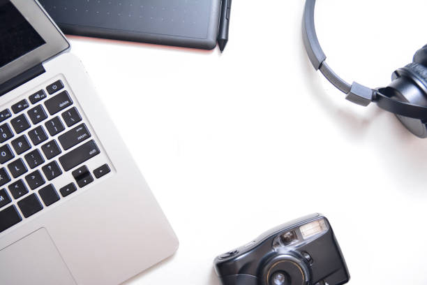 istock Workspace, laptop, headphones, camera and tablet on a white background. Flat lay with 1148852868