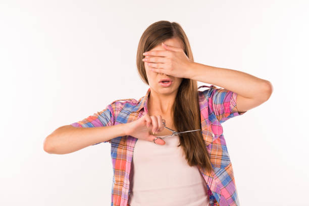 istock girl cut her long hair 1148853075