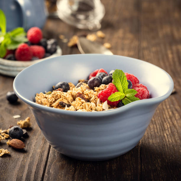 istock Oat granola with berries and yoghurt 1148853941