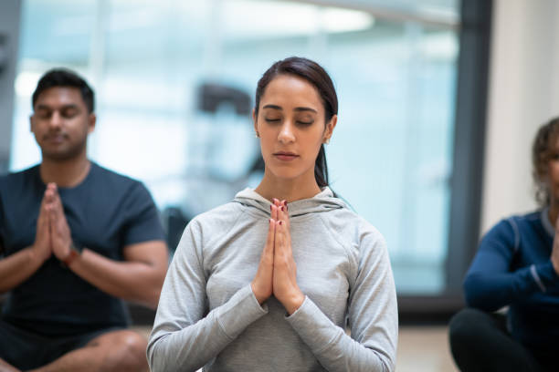 istock A diverse group of people doing a yoga class 1148855602